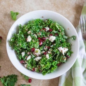 kale and quinoa salad with pomegranates goat cheese and and a delicious champagne dressing