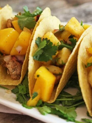 easy chicken tacos with pineapple mango salsa cover