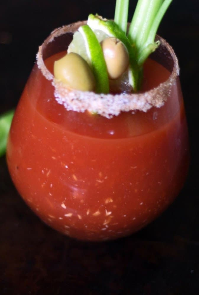 A thirst quencher of a cocktail, the perfect Bloody Mary with a twist of lime, olives and celery.