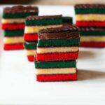 Italian rainbow cookies are three level cookies with apricot and raspberry jam between each layer