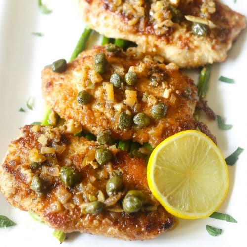 low carb lemon chicken piccata made with almond flour, white wine, shallots and capers.