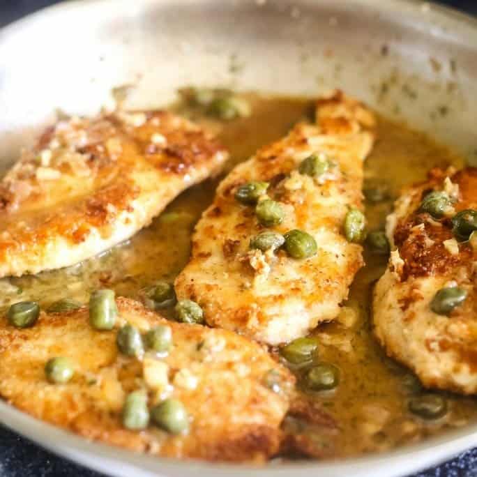 low carb lemon chicken piccata made with almond flour, white wine, shallots and capers.