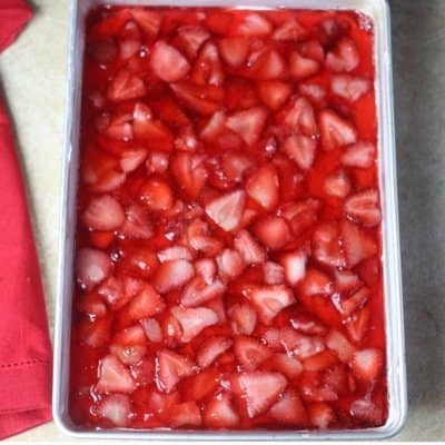 An aerial shot of the best strawberry pretzel salad recipe. The top strawberry jello recipe is set and ready to be eaten and enjoyed