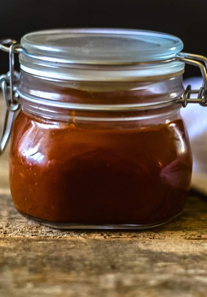 chipotle BBQ sauce in a mason jar ready for basting beef on the grill