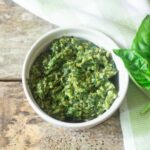 The most delicious homemade skinny basil pesto ready to be added to a great bowl of pasta