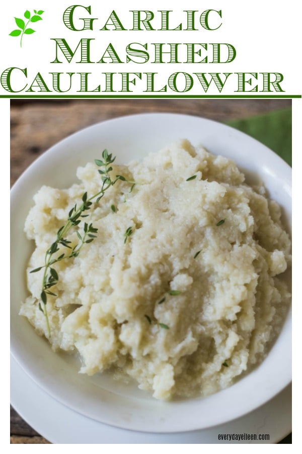 a pinterest image for garlic cauliflower mash in a white bowl