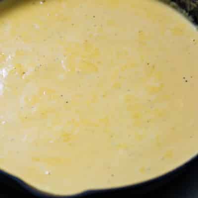Melted cheese including mozzarella, cheddar, and cream cheese with lager and spices to make a delicious hot beer cheese dip