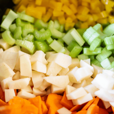 Carrots, potatoes, celery, yellow peppers, onions, and garlic - the ingredients for slow cooker Manhattan Clam Chowder