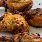 Marinated Chicken baked in the oven and served on a platter.