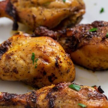 Marinated Chicken baked in the oven and served on a platter.