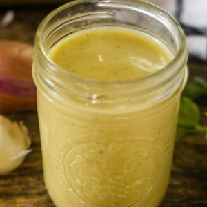 Delicious homemade champagne vinaigrette in a clear mason jar.