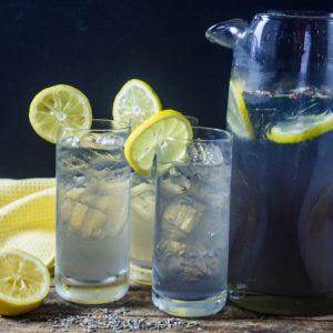 lavender lemonade made with Torani syrup served in joy jolt glasses