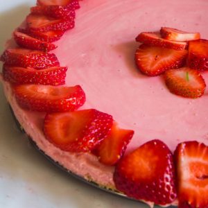 strawberry cheesecake topped with fresh strawberries