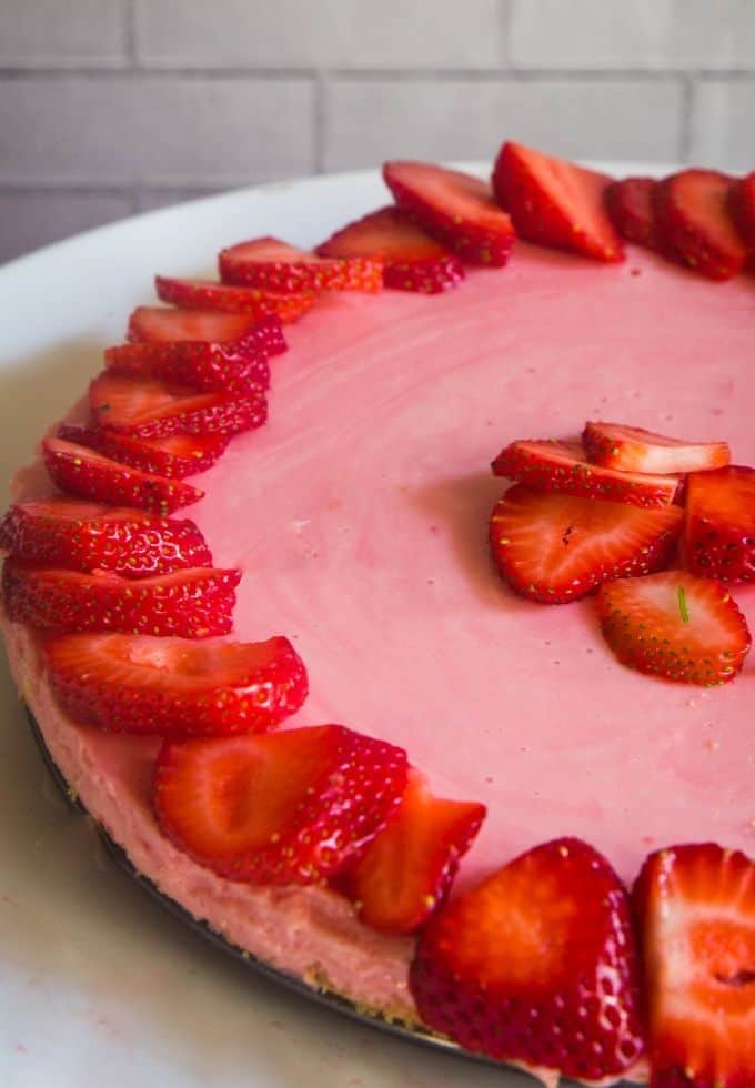 Refreshing no bake strawberry cheesecake topped with fresh strawberries