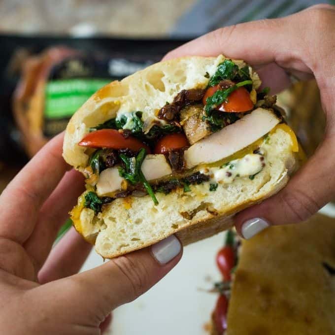 A tasty half of a pork with spinach and sun dried tomatoes