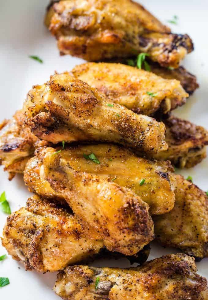 a delicious tray of baked chicken wings.