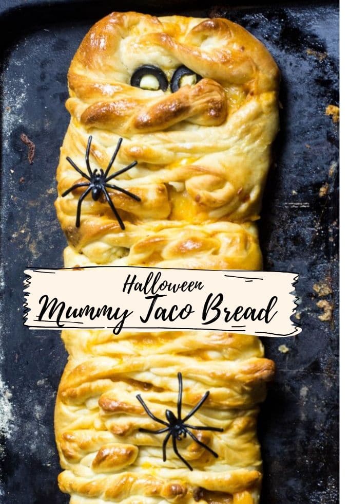 A mummy taco bread on aa baking tray ready to be served for a Halloween treat.
