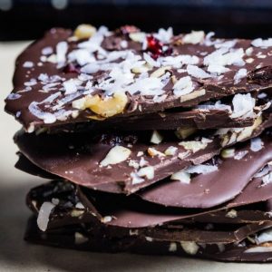 Chocolate Bark stacked up on a piece of parchment paper
