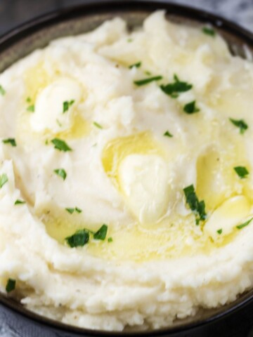 Warm Creamy Mashed Potatoes with melting butter that were made in the Instant Pot.