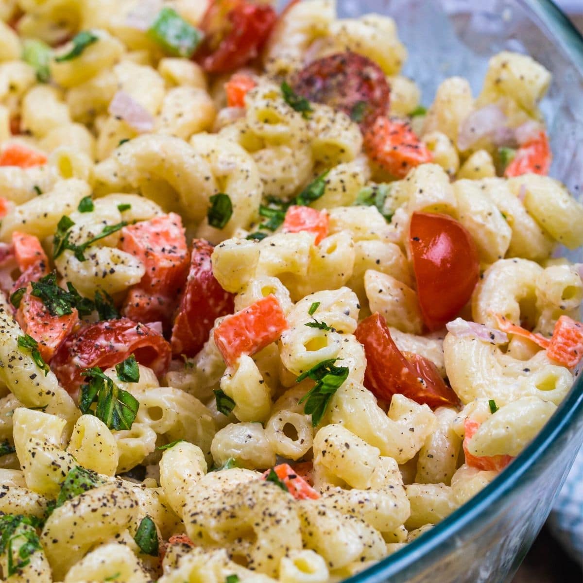 Homemade light mac salad with tomatoes.