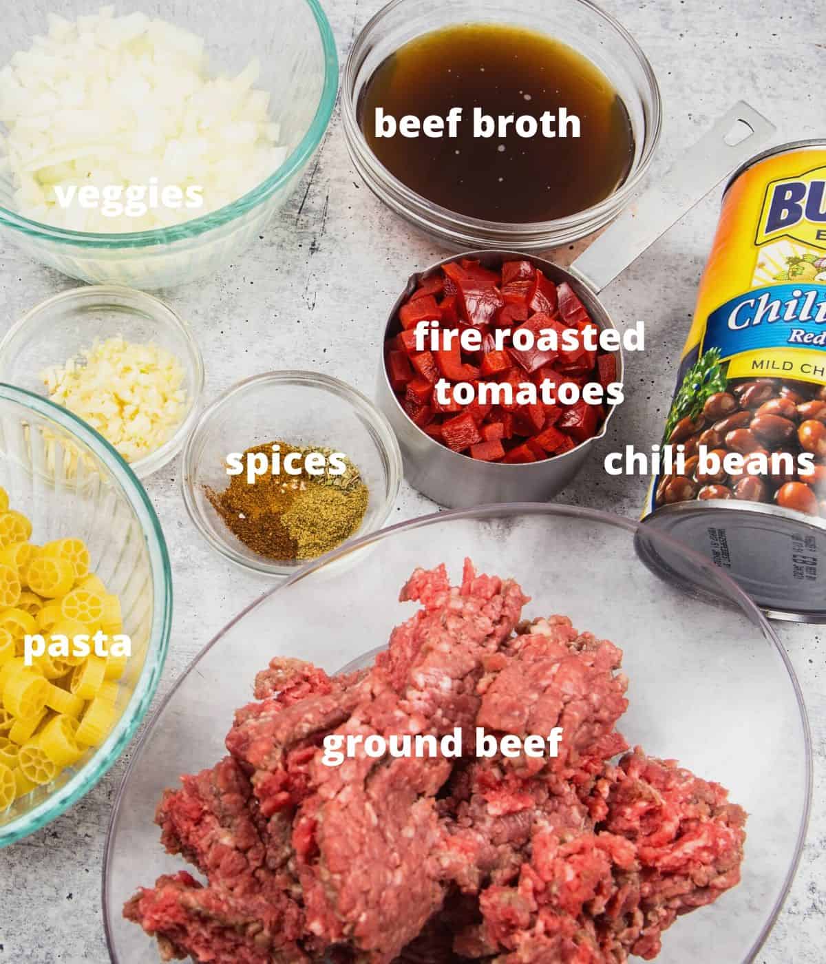 ingredients to make chili mac: beef broth, diced tomatoes, pasta, ground beef, spices, onion, cheese