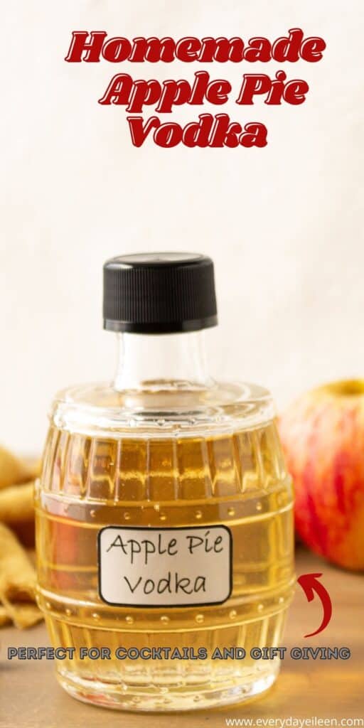 A glass jar filled with apple pie vodka.