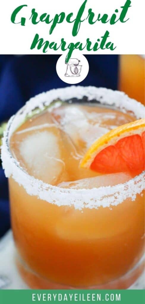 Grapefruit margarita in a clear glass with a salted rim