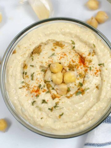 an overhead view of chickpea hummus in a bowl