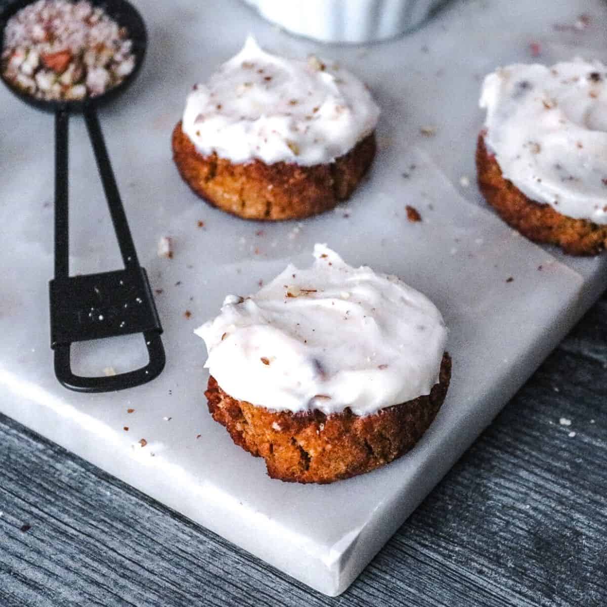 keto Snickerdoodle topped with pecan cream cheese frosting