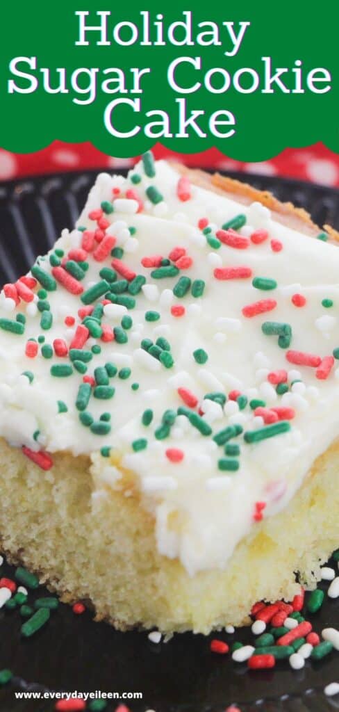 A slice of white cake on a black plate with cream cheese frosting and sprinkles