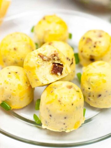 A glass plate with egg bites on it.