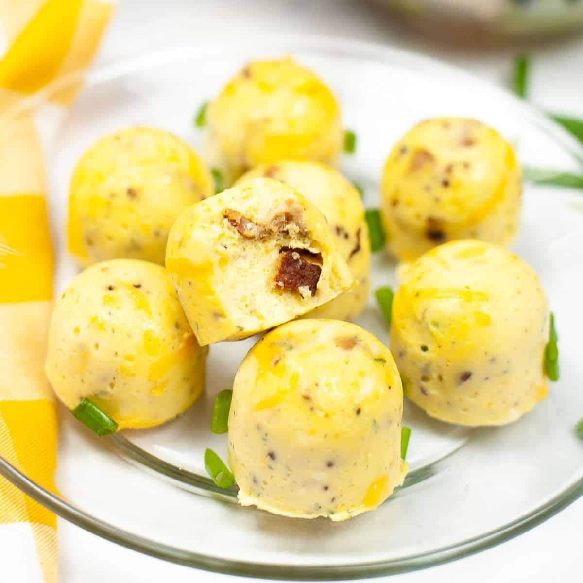 A glass plate with egg bites on it.