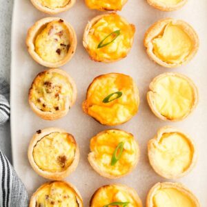 Mini quiches on a platter.