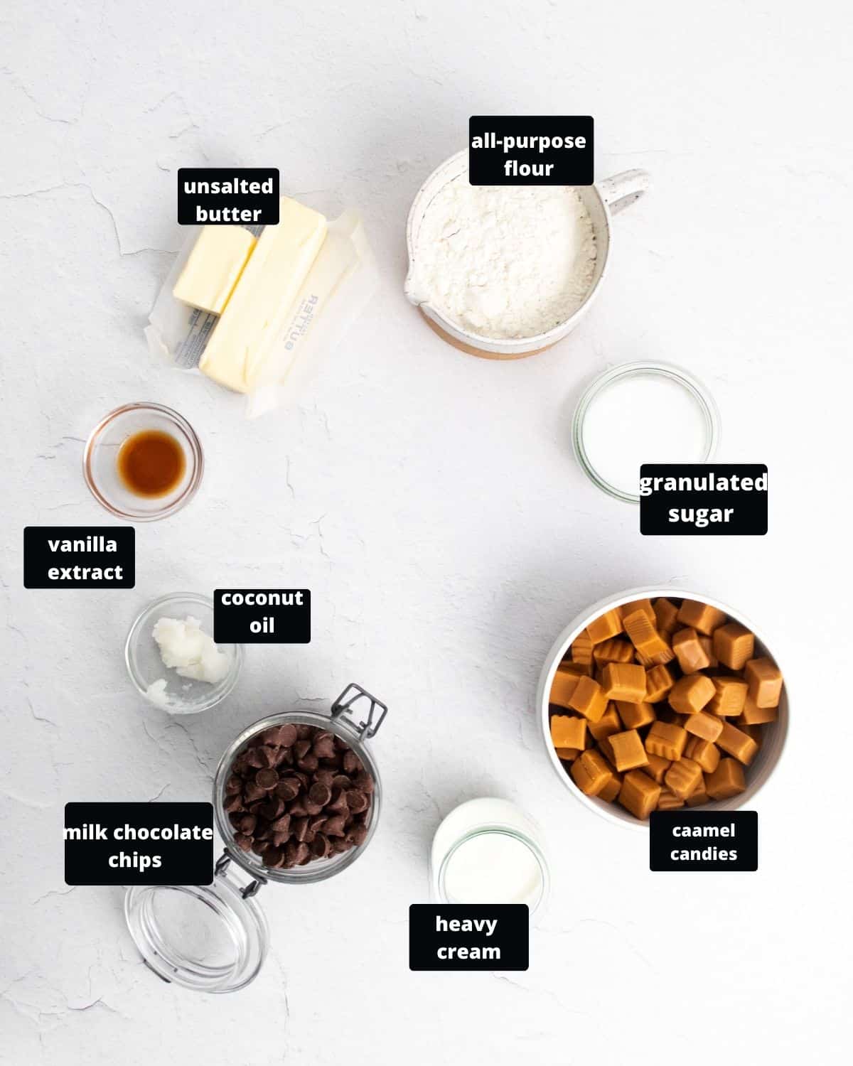Ingredients to make Twix bars on a white table.