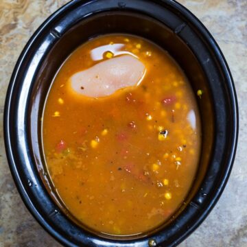 Enchilada soup in the slow cooker vessel.
