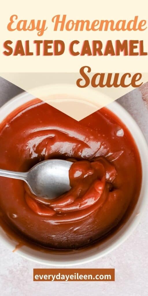 a bowl of amber colored salted caramel sauce with a spoon dipping into the sauce.