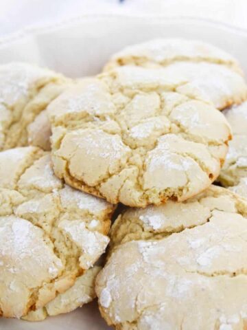 Vanilla crinkle cookies stacked on top of each other.
