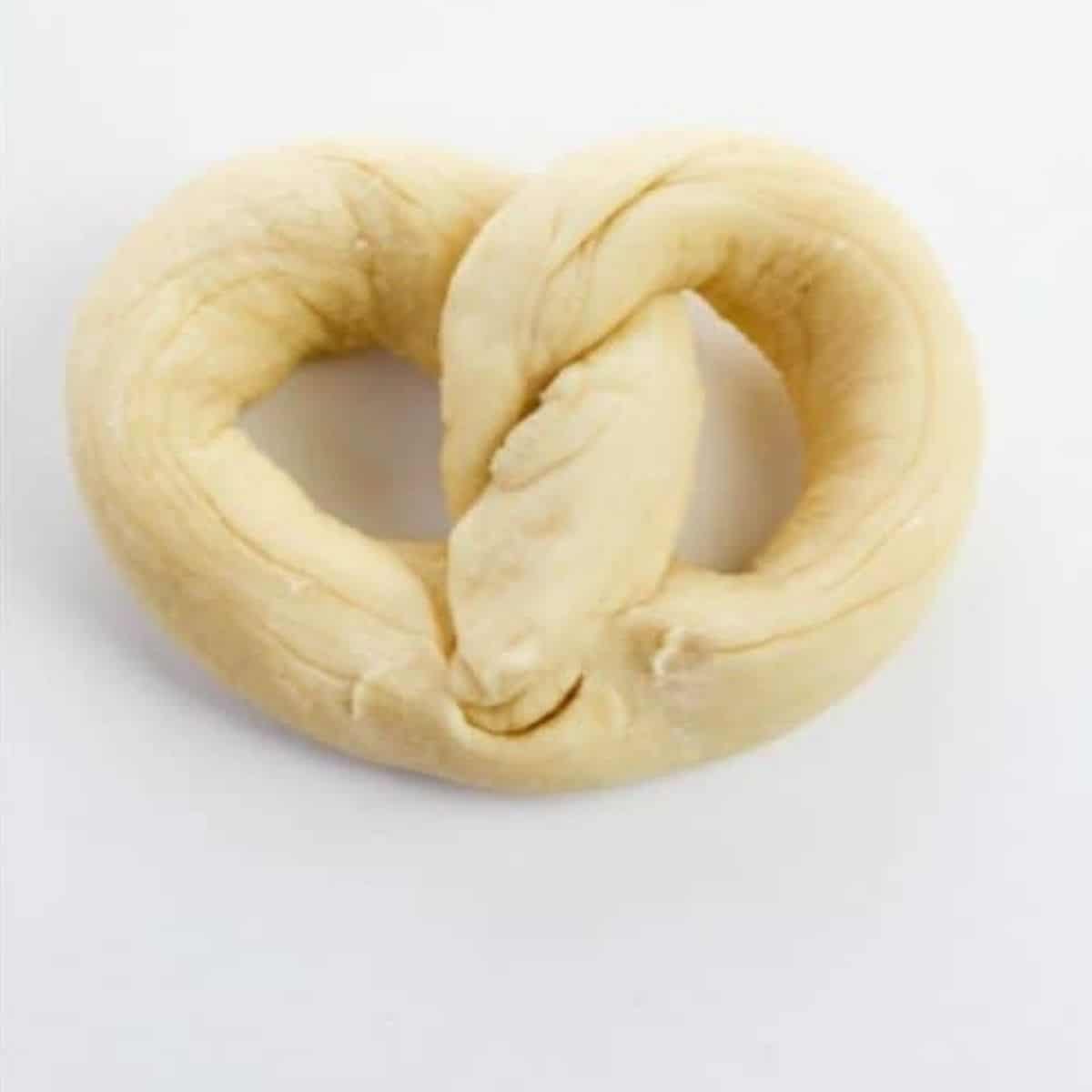 Dough shaped into a pretzel.