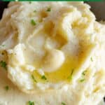 A pinterest pin for homemade mashed potatoes with herbs behind the bowl.