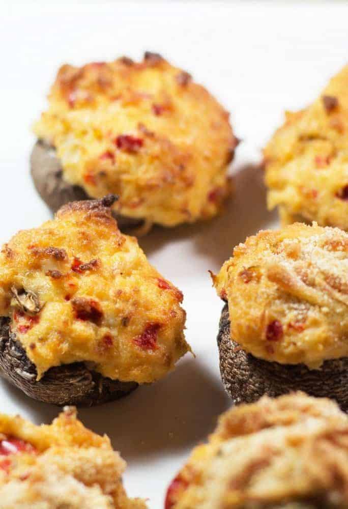 Stuffed mushrooms on a white plate.