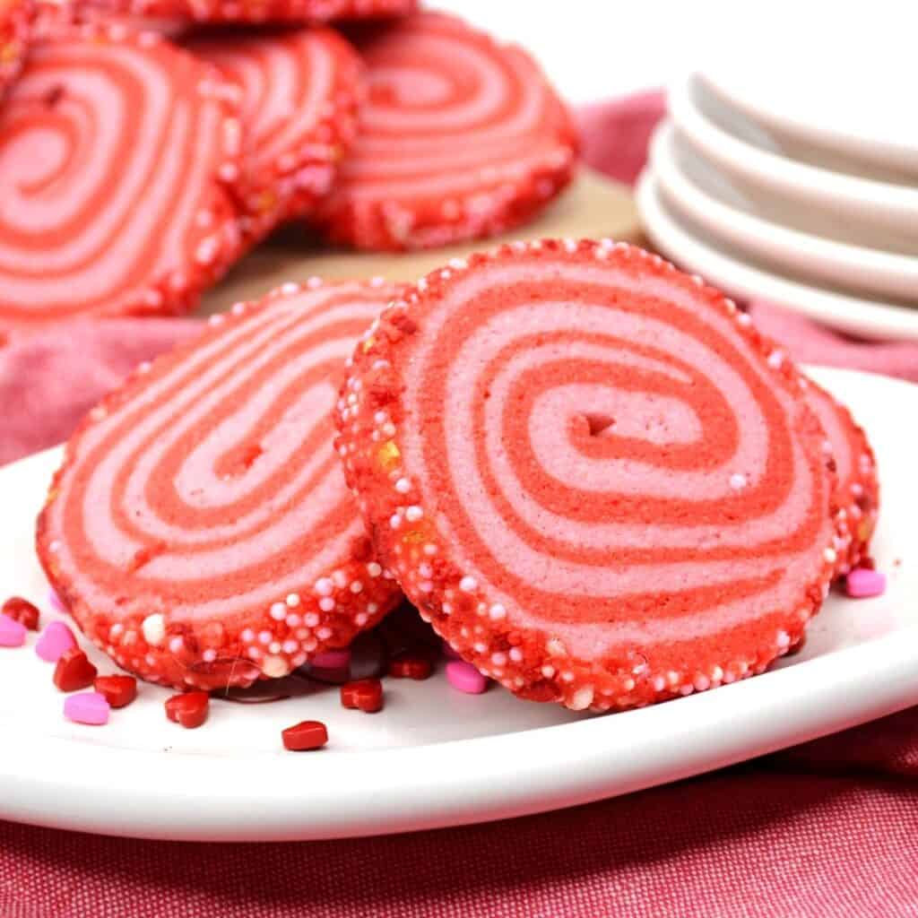 Valentine's Day pinwheel cookies on a plate. 