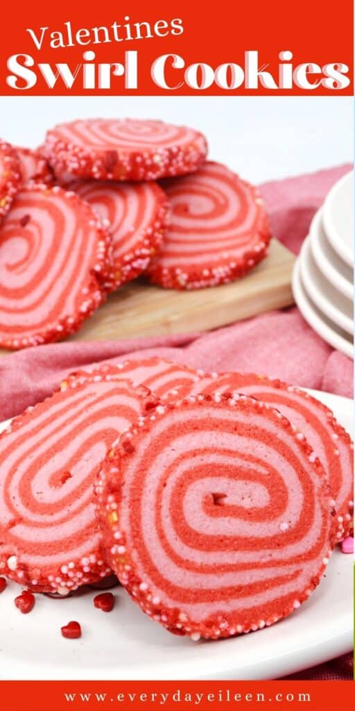 Pinwheel cookies colored in pink and red on a white plate.