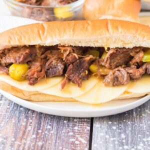 Slow Cooker Italian beef on Italian bread with provolone cheese.