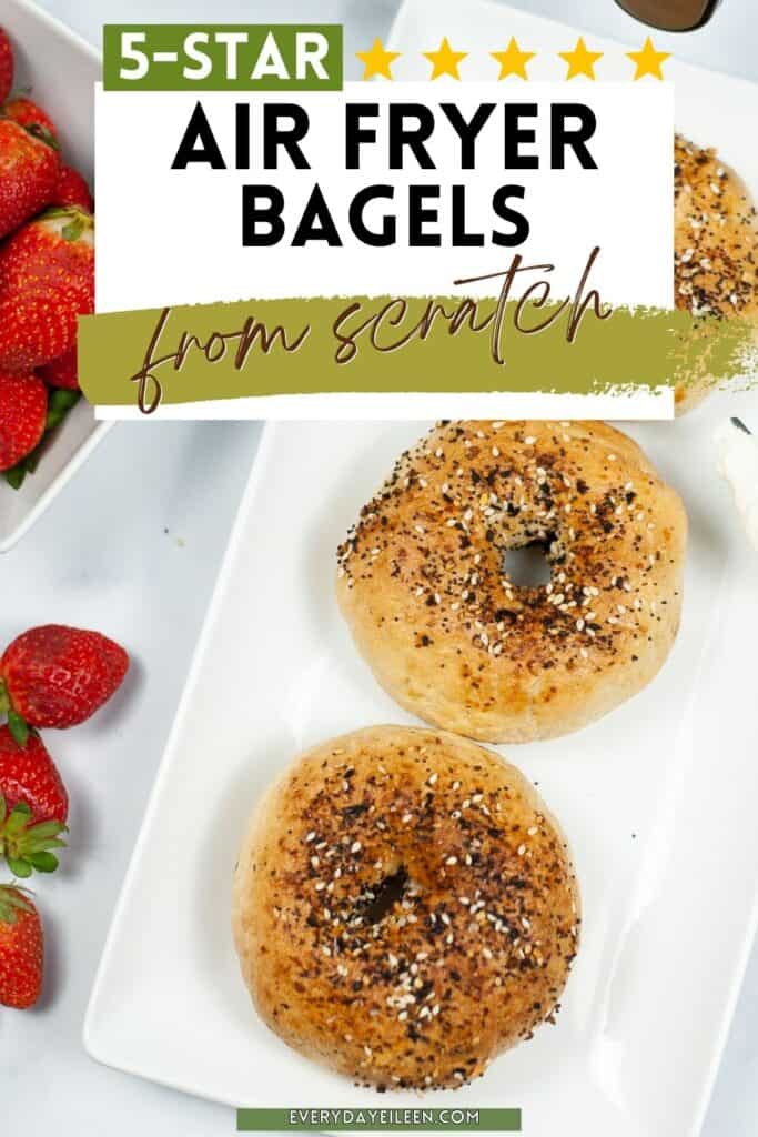 Text overlay for Pinterest of bagels topped with everything seasoning on a white rectangle plate with strawberries next to the plate.