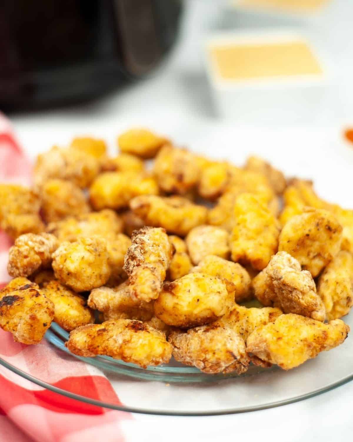 Chick Fil A nuggets on a plate that have been baked. 