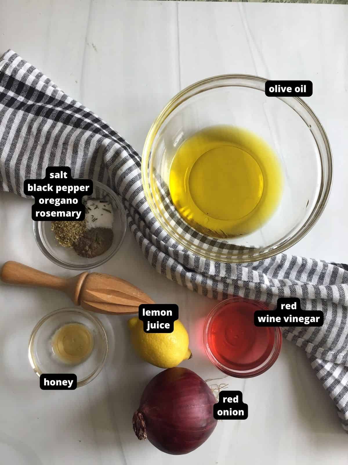 Ingredients with text overlay of what is needed to make greek marinated chicken