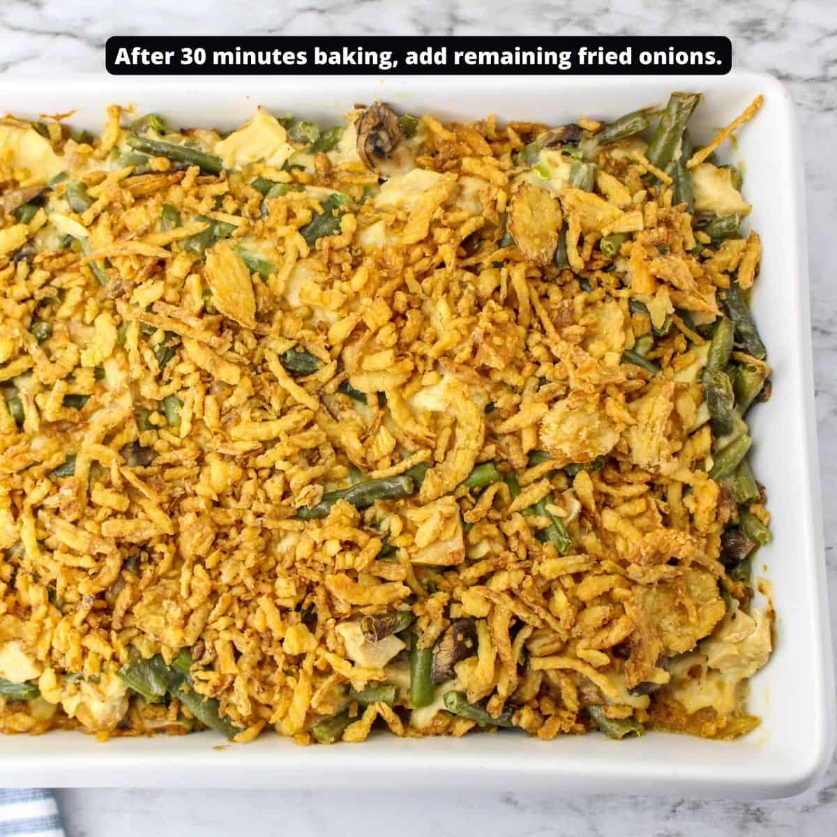 A casserole with green beans, chicken, and topped with fried onions.