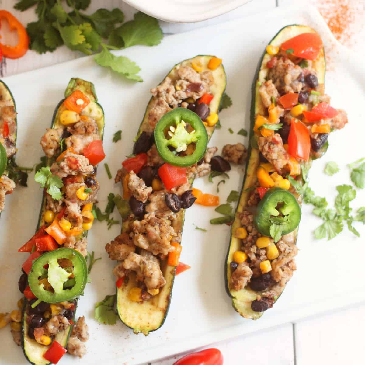 Zucchini stuffed with ground chicken and veggies. 