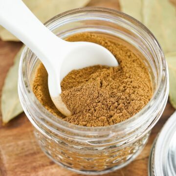A mason jar with a homemade spice mix to use for savory apple dishes.