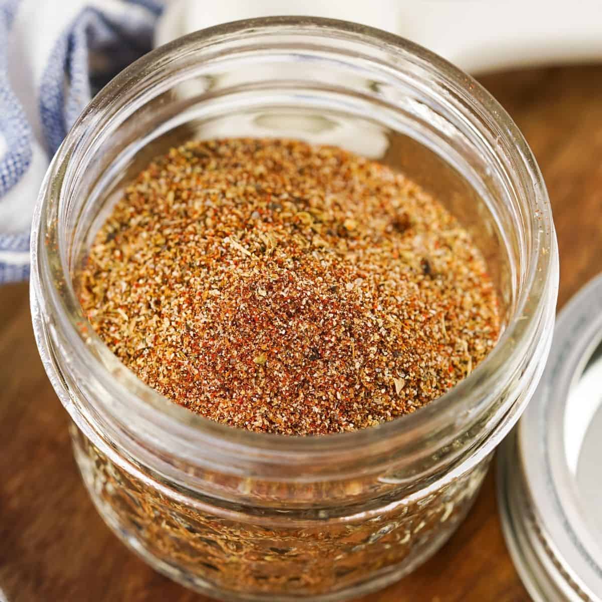 An overhead view of a glass mason jar with spices in it.